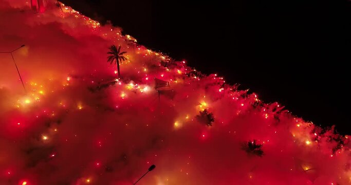 drone view of sky painted red with torches