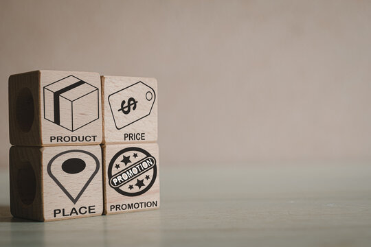 4Ps or PPPP of marketing concept.,PRODUCT,PRICE,PLACE,PROMOTION icon and word on wooden cubes in left corner image with copyspace for put text or logo.
