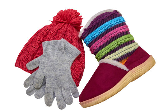 knitted cap with gloves and boots,warm winter clothes for a girl on a white background