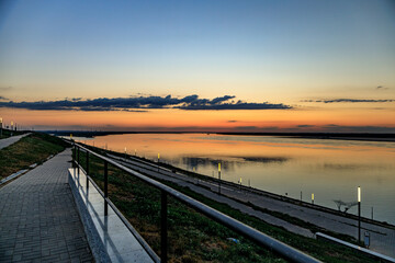 Calm sunset Volga bright Yar, calm evening on the river