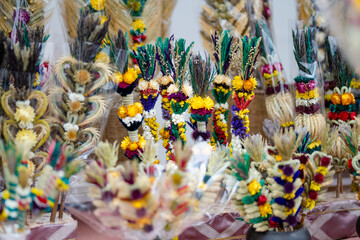 Fototapeta na wymiar Traditional Lithuanian Easter palms known as verbos sold on Kaziukas, Easter market in Vilnius