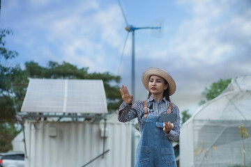 person holding solar panels. person with solar panels. person with turbine