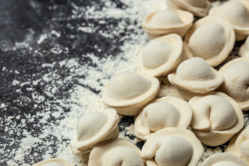 Uncooked homemade pelmeni. Step by step process of making homemade raw ravioli, Meat Dumplings. Food recipe background. Close up