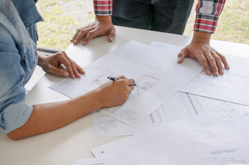 Architecture drawing on architectural project business architecture building construction Colleagues interior designer Corporate. Planning Design on blueprint Teamwork with compasses.