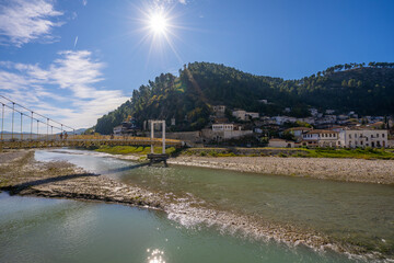 Obraz premium View to Berat, historic city in the south of Albania at night with all lights flashing and white houses gathering on a hill. Captured during blue hour with the sky full of stars.