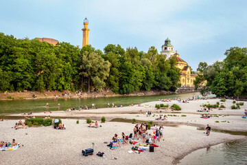 Teenagers sunbathing at the Isar river Munich, Bavaria, Germany..Teenagers sunbathing at the Isar river Munich, Bavaria, Germany..