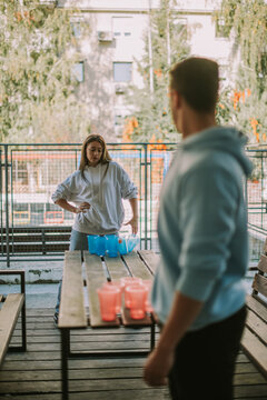 Friends Playing Beer Pong