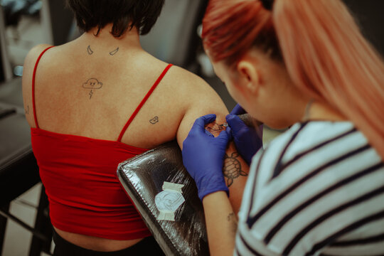 Close up of tattooing