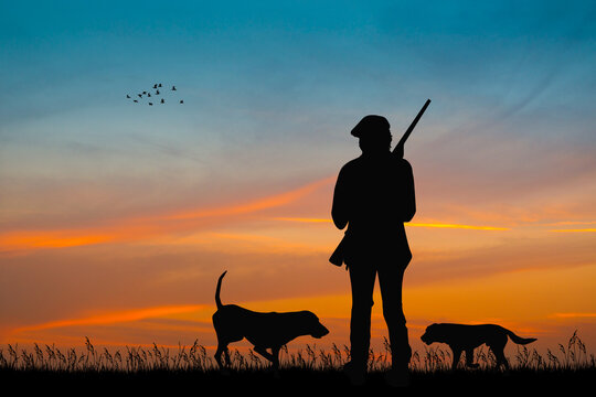 silhouette of hunters at sunset
