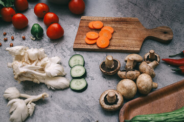Various vegetables for healthy vegan food on gray background