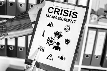 Crisis management concept on a clipboard