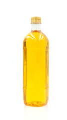 Vegetable oil cooking in plastic clear bottle with lid isolated on white background.