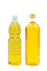 Vegetable oil cooking in plastic clear bottle with lid isolated on white background.
