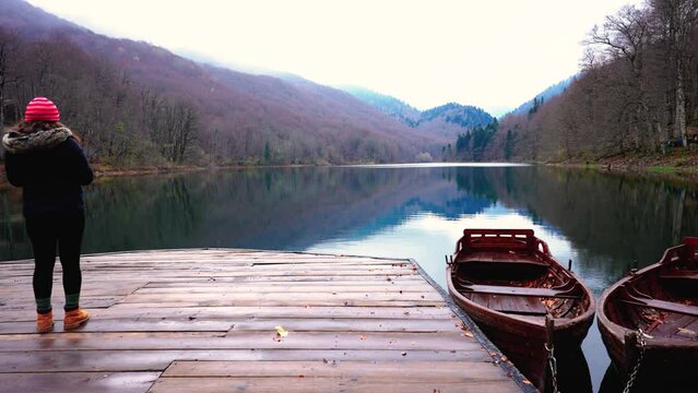 4K Footage of Biograd lake of montenegro, boats on dock and beautiful nature with trees and hiking road on coast