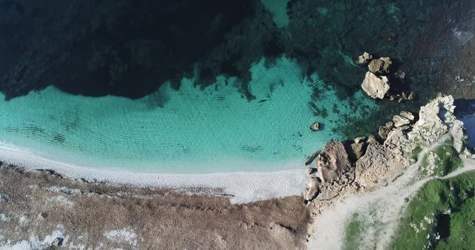 aerial view of the crystalline waters of the sea of ​​is arutas beach in sardinia
