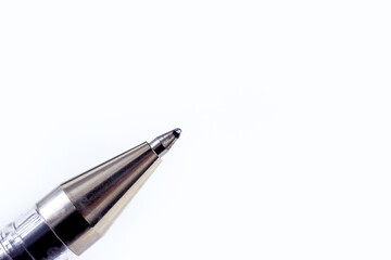 Metal ballpoint pen on light background close up with copy space. - 558409706