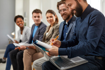 Cheerful people communicate with each other during break on business lecture, share experiences and...