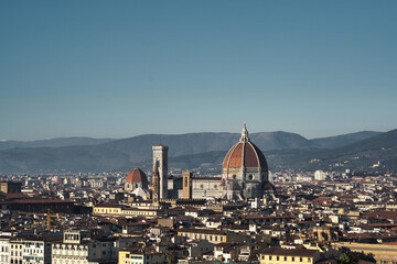Fototapeta na wymiar Scenic view on Florence old town in Italy with Duomo Cathedral of Santa Maria del Fiore and Giotto's Bell Tower