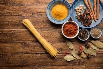 pices and herbs on old kitchen table. Food and cuisine ingredients.