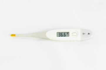 Digital thermometer showing the temperature of 36.6 C