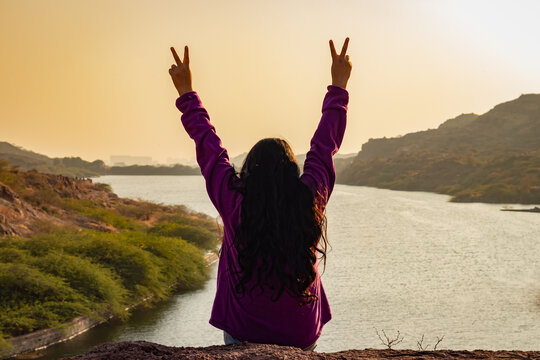 Isolated Young Girl At Mountain Top With Lake View Backbit Shot From Flat Angle