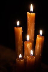 Six burning candles against a black background. International Holocaust Remembrance Day, January 27.