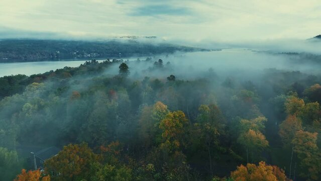 Autumn foliage aerial view in Lake George with morning fog