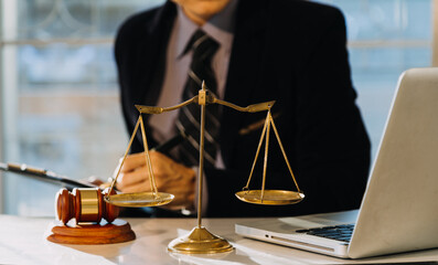 Business and lawyers discussing contract papers with brass scale on desk in office. Law, legal...
