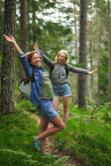 Fototapeta premium charming cute smiling girls with an open, honest faces against a forest in a soft light