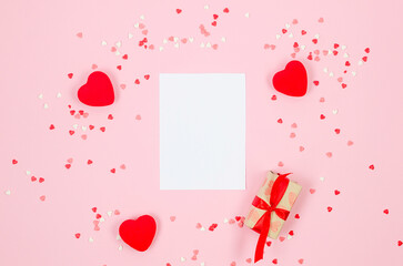 Fototapeta na wymiar Sugar hearts confetti and gift box on pink background. Valentine's Day concept. weddings, engagements, Mother's Day, birthday. Greeting card with place for text