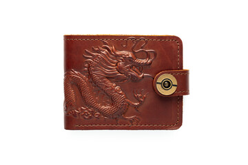 Brown leather wallet on a button on a white background. Top view. Dragon print