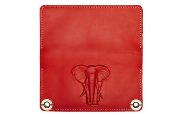 Big red leather wallet on a button on a white background, elephant print. Top view