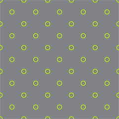 Tile vector pattern with green polka dots on pastel grey background