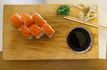 sushi on a wooden board. Sushi set on a wooden board. Sushi, wasabi and soy sauce