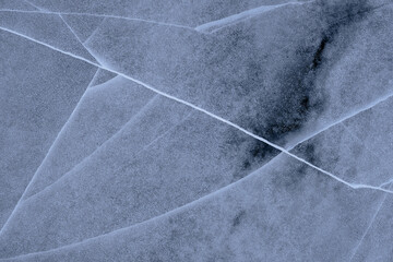 crystal clear frozen ice in winter