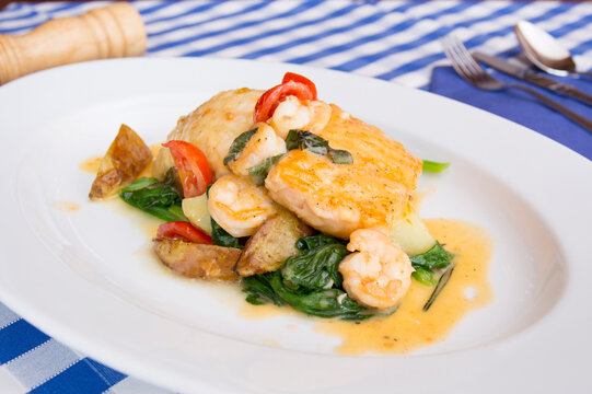 Monkfish with prawns and vegetables in a Spanish restaurant.