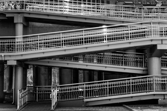 Overpass ramp with railings. Abstract image of metal structures