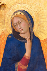 Medieval portrait of female catholic saint with a golden halo
