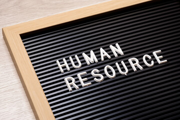 Closeup Human Resource text insert in the advertising sign, HR, and human resource concept