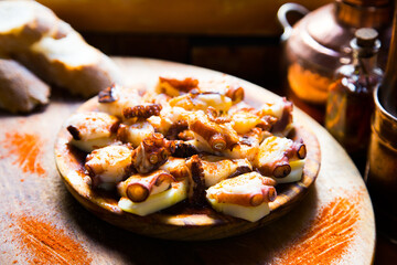 Pulpo a la Gallega. Octopus cooked with boiled potato, paprika and olive oil. Galician octopus recipe north of Spain tapa.