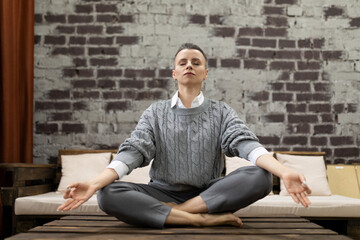 young woman relax sitting in room in lotus position