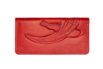 Big red leather wallet on a button on a white background, crocodile print. Top view