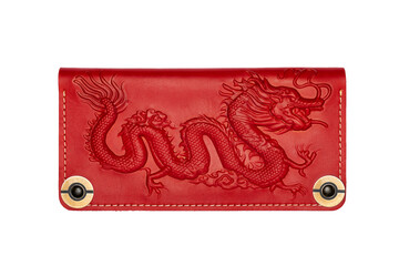 Big red leather wallet on a button on a white background, dragon print. Top view