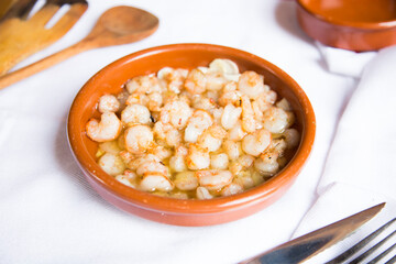 Gambas al ajillo. Shrimp Scampi. Traditional tapa recipe from the south of Spain cooked with seafood and sautéed garlic.