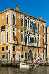 Fototapeta na wymiar Banner of the Science University Art on the Grand Canal of Venice against Academy Bridge