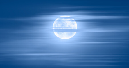 Night sky with full bright moon in the clouds 