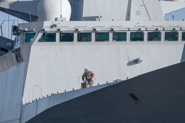 An armed soldier aboard an army warship. Security of army ships © Armands photography