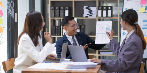 Group of young asian modern people in smart casual wear having a brainstorm meeting. Group of young asian business people discussing in the meeting.
