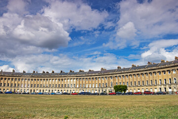 The listed Georgian Royal Crescent in Royal Bath Spa in England under blue skies