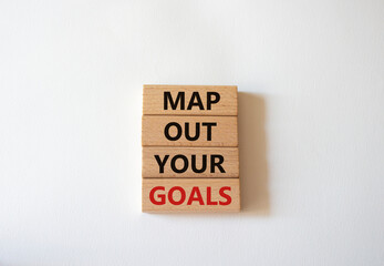 Goals symbol. Wooden blocks with words Map out your goals. Beautiful white background. Business and 'Map out your goals' concept. Copy space.